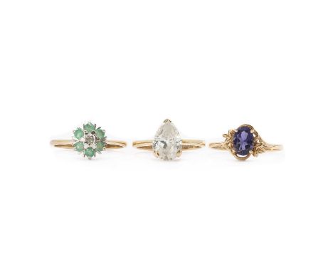 Three gold rings, comrpising a 9ct gold single stone cubic zirconia ring, London 1976, a 9ct gold diamond and emerald cluster