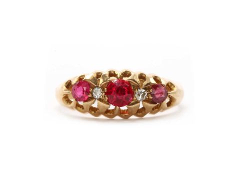 An 18ct gold synthetic ruby and diamond ring, the boat shaped head claw set with alternating round mixed cut synthetic rubies