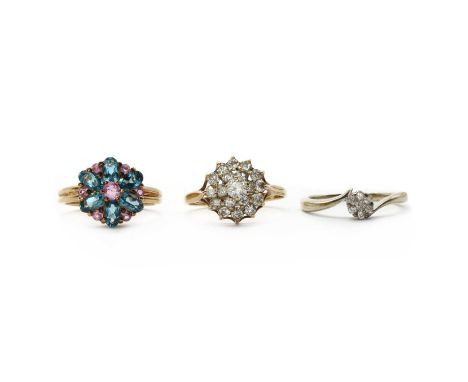 Three 9ct gold rings,comprising a 9ct gold cubic zirconia cluster ring, Birmingham 1981, a 9ct gold pink sapphire and blue to