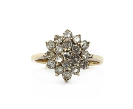 A 9ct gold diamond cluster ring, a cluster of eight cut diamonds, claw set, top tapered shoulders and a plain shank, London 1