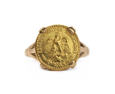 A gold coin ring, with a Mexican Dos 2 Pesos coin, claw set, to trifurcated shoulders and a plain shank, tested as approximat