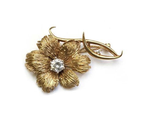 A 9ct gold cubic zirconia set flower brooch,with pin and roller catch, London 1977, 12.70gCondition ReportSurface marks/scrat