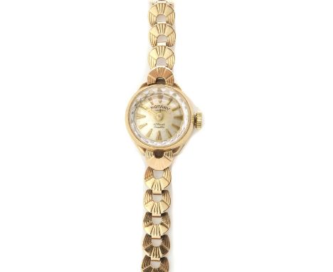 A ladies' 9ct gold Rotary mechanical bracelet watch, with a silvered dial and baton hour markers, to integral crescent link b