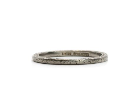 A platinum wedding ring,with engraved decoration, engraved to the inside 'M.E.H. - W.A.P. 25.4.42', marked platinum, 2.96g.Fi