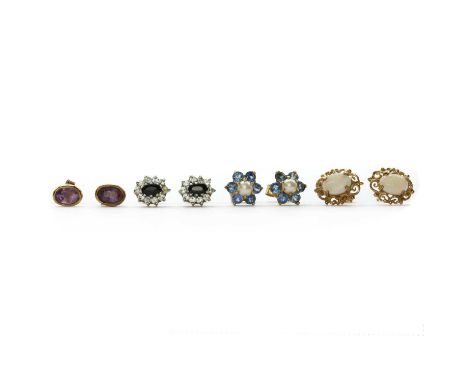 Four pairs of gold stud earrings, comprising a pair of single stone amethyst earrings, tested as approximately 9ct gold, a pa