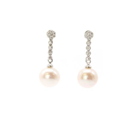 A pair of white gold cultured freshwater pearl and diamond drop earrings, with a cultured freshwater pearl, peg set, surmount