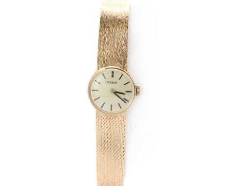 A ladies' 9ct gold Tissot mechanical bracelet watch, 19mm diameter with a gilt dial and baton hour markers, to integral, tape