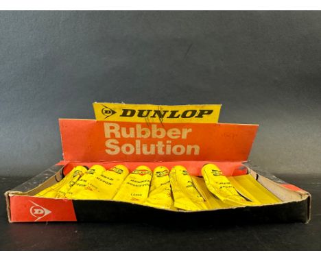 A Dunlop Rubber Solution counter top dispensing box with contents. 