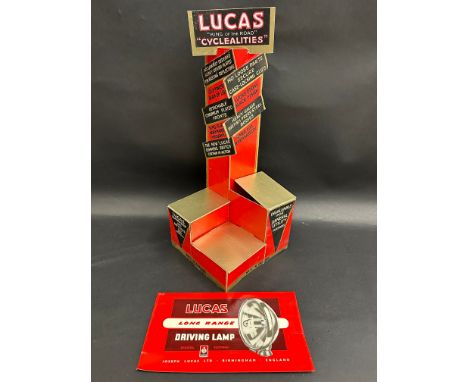 A Lucas Cyclealities cardboard display stand plus a driving lamp advertisement.