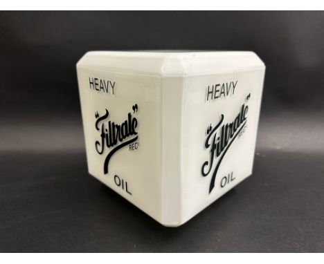A reproduction milk glass square lamp shade bearing advertising for Filtrate Oil.