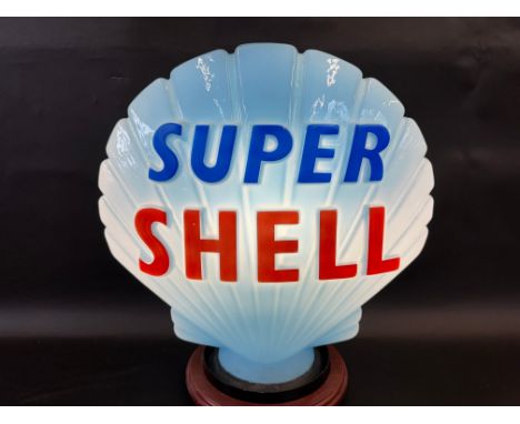 A blue Super Shell glass petrol pump globe by Hailware, excellent bright letters but repaired chip to neck under rubber ring.