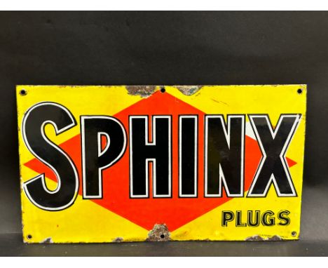A small Sphinx Plugs enamel sign by Wood &amp; Penfold, 16 x 9".