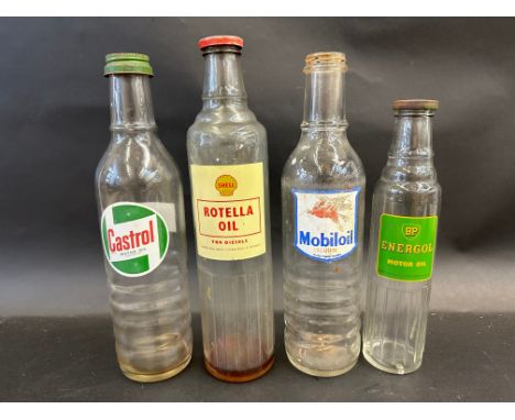 Three quart oil bottles including Shell Rotella Oil and a BP Energol pint bottle. 