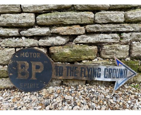 A BP 'To the Flying Ground' cardstock and printed paper directional arrow sign, 35 1/2 x 12".