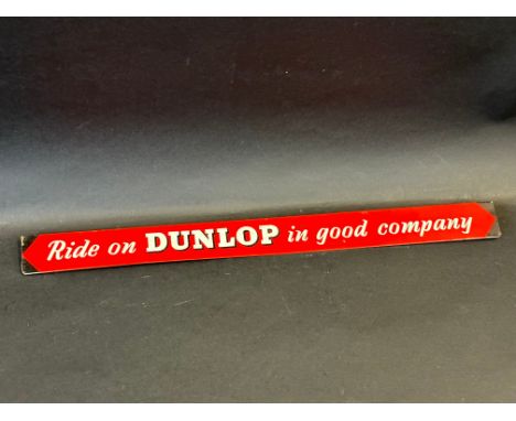 A 'Ride on Dunlop in Good Company' shelf strip. 