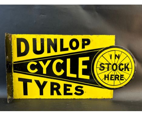 A Dunlop Cycle Tyres In Stock Here double sided enamel sign with hanging flange, some older spots of retouching, 27 x 14". 