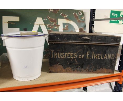 A BLACK METAL TRUNK TOGETHER WITH AN ENAMEL BUCKET