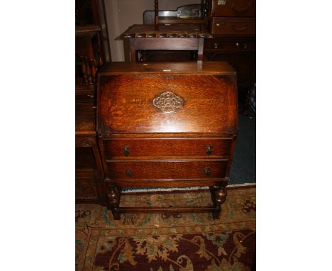 A VINTAGE OAK TWO DRAWER BUREAU W - 75 CM 