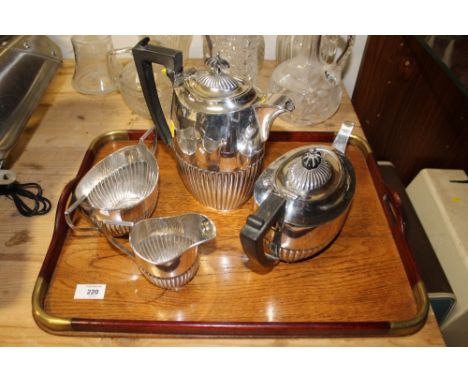 A WOODEN TRAY WITH BRASS INLAY TOGETHER WITH A FOUR PIECE SILVER PLATED TEA SERVICE