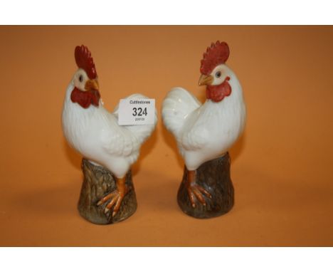 A PAIR OF CERAMIC HAND PAINTED COCKERALS