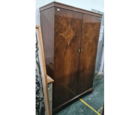 Mid 20th century walnut two-door wardrobe on ogee bracket feet, 115 x 184cm