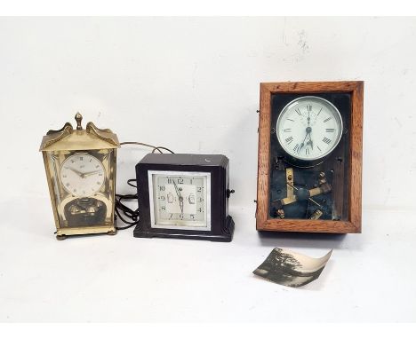 Early 20th century alarm clock in chrome case, modified and mounted in glazed wooden case to activate mechanical electrical s