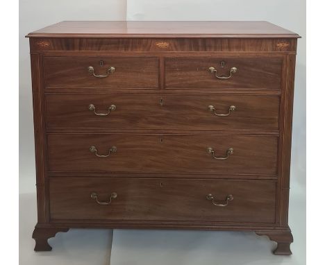 19th century mahogany chest of drawers, the rectangular top with applied moulded edge, with inlaid frieze above the two short