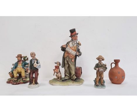 Collection of four various Capodimonte-style unglazed pottery figures to include a Portuguese pottery vagrant seated on a ben