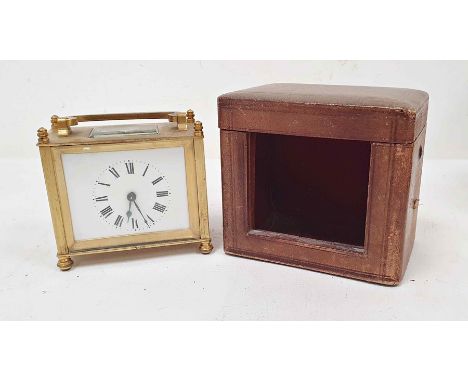 Brass and glass carriage clock of squat form, with Roman numerals to the dial, in carry case