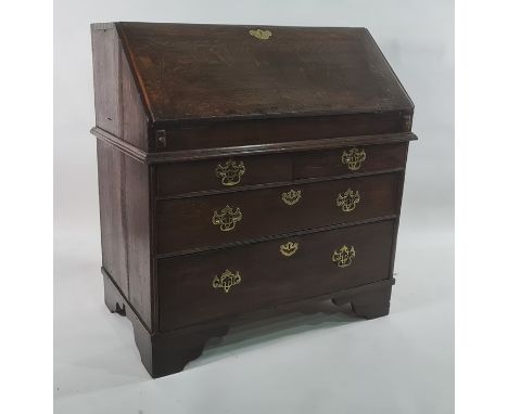 18th century oak bureau bookcase with cavetto moulded cornice above two panelled doors enclosing shelves, fitted interior wit