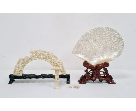 Chinese carved shell, intricately pierced and carved with ducks on a pond surrounded by flowers and birds, 23cm long, on hard