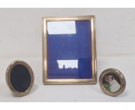 Late 20th century rectangular silver-mounted picture frame, Birmingham 1997, makers R&Co, 23.1cm x 18.4cm, a miniature oval s
