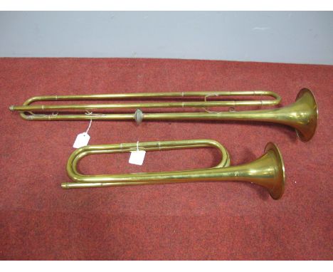 A Mid XX Century Boosey & Hawkes Brass Bugle, and a further brass bugle, unnamed. (2)