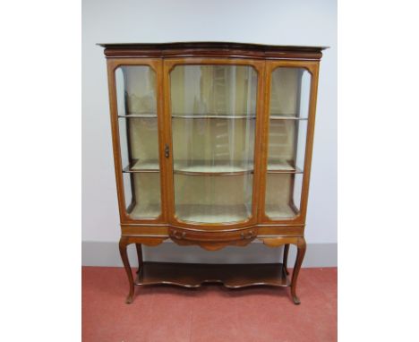 An Edwardian Inlaid Bow Fronted Display Cabinet, with cushion frieze and central glazed bow fronted door over single drawer, 