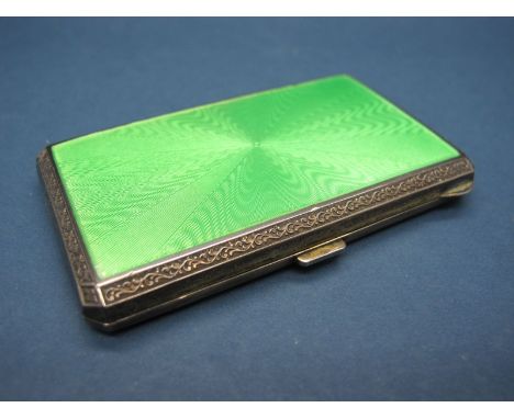 A Hallmarked Silver and Enamel Cigarette Case, (makers mark rubbed) import marks for London 1927, allover engine turned, high