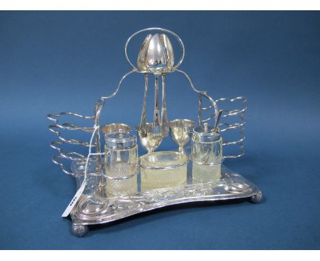 A B.H.A. EPNS Egg Cruet Stand, with two toast racks, three egg cups, associated spoons and a salt, mustard and pepperette.