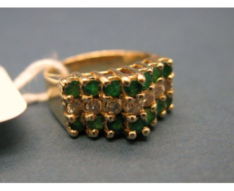 A Modern Emerald and Diamond Set Dress Ring, of stepped design, claw set throughout, stamped "14K 585". *H. Samuel Insurance 