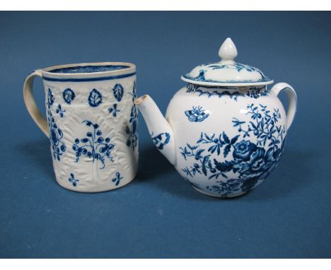 An Early XIX Century Pearlware Pottery Mug, of cylindrical form, moulded with foliage and painted in blue with floral sprigs 