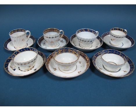 Two Worcester Porcelain Tea Bowls and Saucers, of fluted form, decorated in dark blue and gilt with foliage, flowers and butt