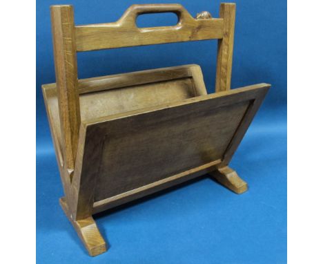 A Robert 'Mouseman' Thompson Oak Magazine Rack, with sloping sides, on sledge feet, with carved mouse signature to the handle