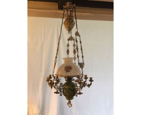 A Continental XX Century Art Nouveau Style Brass Raise and Pull Ceiling Oil Lamp, cast with Rococo scrolls to nine candle sco