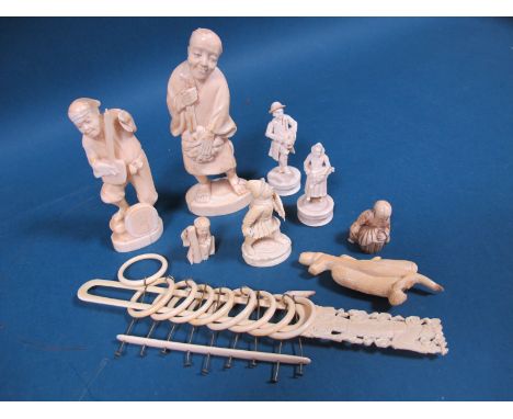 A Late XIX Century Japanese Ivory Figure of a Gentleman, holding a lute, 12.5cms high; Another, a gentleman holding a fruit; 