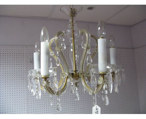A Mid XX Century Spanish Glass Ceiling Light, having five scroll branches and pear shaped lustre drops to floret mounts.