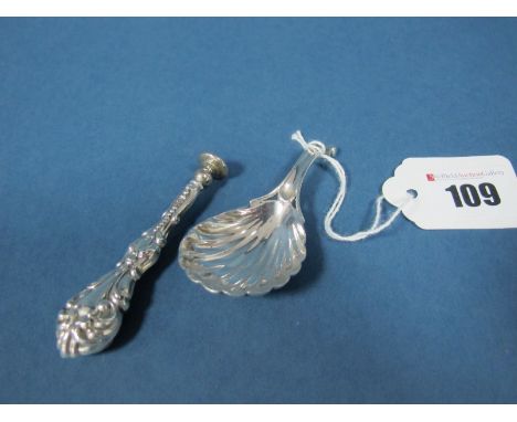 A Hallmarked Silver Caddy Spoon, (makers mark rubbed) possibly London 1830, with shell bowl and scroll handle; Together with 