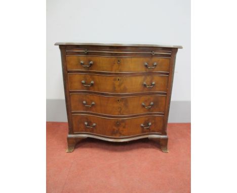 An XVIII Century Style Mahogany Serpentine Shaped Chest of Drawers, with brushing slide, four graduated drawers, canted corne