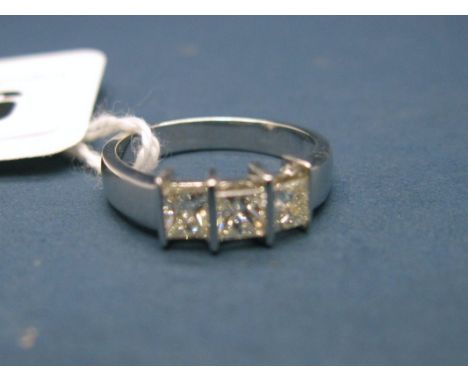 A Modern 18ct White Gold Princess Cut Three Stone Diamond Ring, the uniform stones bar set.  