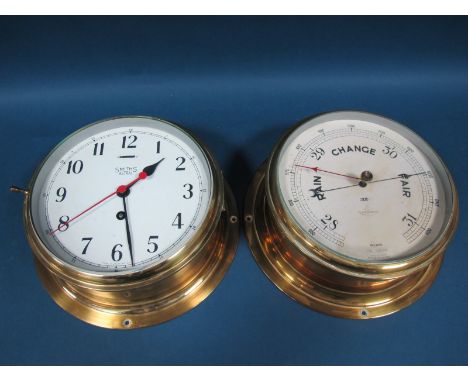A Smith's Astral Ship's Wall Clock, with white dial, winding hole and slow-fast function, within a brass case, overall diamet