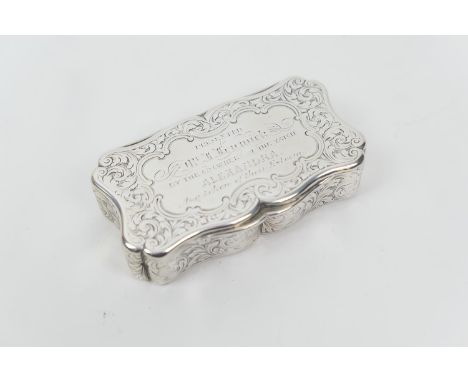 Victorian silver presentation snuff box, by Edward Smith, Birmingham 1850, shaped rectangular form chased with foliate scroll