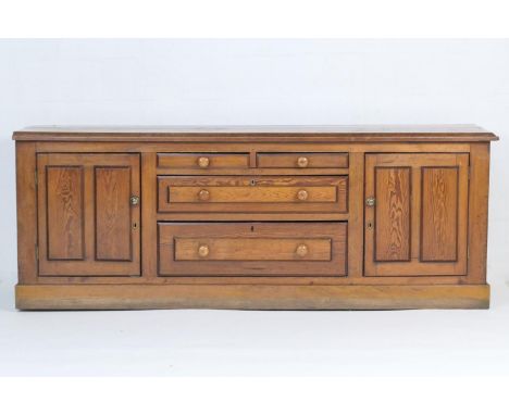 Victorian pitch pine dresser, late 19th Century, fitted with two central short drawers and two long deep drawers, flanked by 