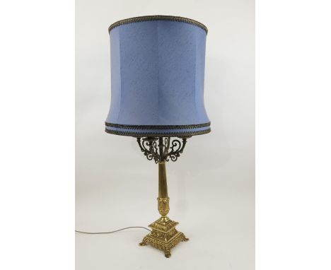 Decorative gilt brass table lamp, late 20th Century, with four candle branches centred with an electric fitting, over a colum